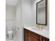 Elegant bathroom with a modern vanity and gold fixtures at 2251 Gulf Of Mexico Dr # 301, Longboat Key, FL 34228