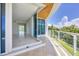 Spacious balcony with glass railings and ocean views at 2251 Gulf Of Mexico Dr # 301, Longboat Key, FL 34228