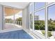 Bedroom with carpet, large windows, and ocean view at 2251 Gulf Of Mexico Dr # 301, Longboat Key, FL 34228
