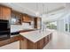 Modern kitchen with large island, custom cabinetry, and top-of-the-line appliances at 2251 Gulf Of Mexico Dr # 301, Longboat Key, FL 34228