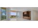 Bright living room with ocean view and built-in entertainment center at 2251 Gulf Of Mexico Dr # 301, Longboat Key, FL 34228
