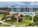 Aerial view of resort community with pool and clubhouse at 2251 Gulf Of Mexico Dr # 301, Longboat Key, FL 34228