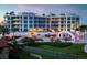 Luxury condo building with pool and ocean views at sunset at 2251 Gulf Of Mexico Dr # 301, Longboat Key, FL 34228