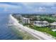 Aerial view of beachfront property with ocean and coastline at 2251 Gulf Of Mexico Dr # 301, Longboat Key, FL 34228