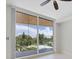 Bedroom with sliding doors leading to a balcony and a lovely view at 2251 Gulf Of Mexico Dr # 301, Longboat Key, FL 34228