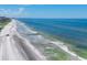Expansive aerial view of beach with ocean and shoreline at 2251 Gulf Of Mexico Dr # 301, Longboat Key, FL 34228