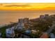 Aerial view of luxurious beachfront property at sunset at 2251 Gulf Of Mexico Dr # 301, Longboat Key, FL 34228