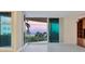 Living room showcasing stunning sunset views from sliding doors at 2251 Gulf Of Mexico Dr # 301, Longboat Key, FL 34228