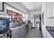 Modern kitchen with stainless steel appliances and a checkered floor at 2251 Gulf Of Mexico Dr # 301, Longboat Key, FL 34228