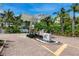 Community entrance with modern design and landscaping at 2251 Gulf Of Mexico Dr # 301, Longboat Key, FL 34228