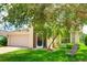 Charming home with a well-manicured lawn and a beautiful, mature tree providing ample shade at 9861 50Th Street E Cir, Parrish, FL 34219