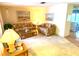 Bright living room with two sofas, a coffee table, and ample natural light at 2434 Fourwind St, Port Charlotte, FL 33948