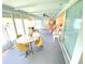 Sunroom features light blue walls and plenty of natural light at 2434 Fourwind St, Port Charlotte, FL 33948