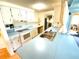 Kitchen features light blue countertops and white appliances at 2434 Fourwind St, Port Charlotte, FL 33948