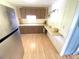 View of kitchen with wood cabinets and light wood flooring at 2434 Fourwind St, Port Charlotte, FL 33948