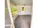 Bright screened porch with gray carpeting and access to backyard at 2434 Fourwind St, Port Charlotte, FL 33948