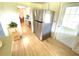 Kitchen features stainless steel refrigerator and exterior access at 2434 Fourwind St, Port Charlotte, FL 33948