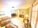 Bright living room with two sofas, a coffee table, and ample natural light at 2434 Fourwind St, Port Charlotte, FL 33948