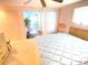 Main bedroom with king-size bed offering access to living area at 2434 Fourwind St, Port Charlotte, FL 33948