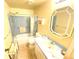 Bathroom with shower/tub combo, toilet and vanity with light blue cabinets at 2434 Fourwind St, Port Charlotte, FL 33948