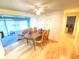 Dining room with table and chairs, adjacent to a sunroom at 2434 Fourwind St, Port Charlotte, FL 33948
