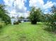 Large backyard with plenty of space for outdoor activities at 2434 Fourwind St, Port Charlotte, FL 33948