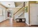 Bright entryway with hardwood floors and a staircase leading upstairs at 1914 24Th W Ave, Palmetto, FL 34221