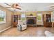 Relaxing living room featuring a fireplace and built-in shelving at 1914 24Th W Ave, Palmetto, FL 34221