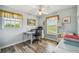 Home office with built-in desk and window views at 1914 24Th W Ave, Palmetto, FL 34221