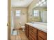Bathroom with double vanity, bathtub and shower at 1914 24Th W Ave, Palmetto, FL 34221