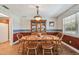 Bright dining area with wood table, chairs, and a lovely view from the window at 1914 24Th W Ave, Palmetto, FL 34221