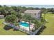 An inviting kidney-shaped pool surrounded by palm trees at 1914 24Th W Ave, Palmetto, FL 34221