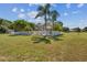 Spacious backyard with a pool, shed, and large grassy area at 1914 24Th W Ave, Palmetto, FL 34221