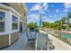 Enjoy the outdoor deck with patio furniture and umbrella at 1914 24Th W Ave, Palmetto, FL 34221