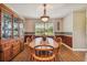 Charming dining room with wood table and chairs, and a built-in hutch at 1914 24Th W Ave, Palmetto, FL 34221