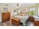 Bright bedroom with king bed, ensuite bathroom access, and ample closet space at 1914 24Th W Ave, Palmetto, FL 34221