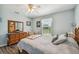 Charming bedroom with a queen bed and wooden furniture at 1914 24Th W Ave, Palmetto, FL 34221