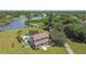 Aerial view of two-story home with pool and lake view at 1914 24Th W Ave, Palmetto, FL 34221