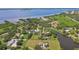 Aerial view showcasing waterfront property and neighboring houses at 1914 24Th W Ave, Palmetto, FL 34221