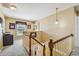 Upstairs hallway with built-in shelves and a view to the lower floor at 1914 24Th W Ave, Palmetto, FL 34221