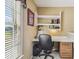 Cozy home office with built-in shelves, desk, and window with blinds at 1914 24Th W Ave, Palmetto, FL 34221