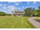 Two-story house with a long driveway and expansive lawn at 1914 24Th W Ave, Palmetto, FL 34221