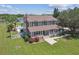 Two-story house with brown roof, pool, and large fenced yard at 1914 24Th W Ave, Palmetto, FL 34221