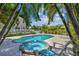 Enjoy the large pool and spa surrounded by tropical landscaping at 1914 24Th W Ave, Palmetto, FL 34221