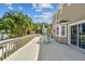 Spacious deck with patio furniture and umbrella, overlooking pool at 1914 24Th W Ave, Palmetto, FL 34221