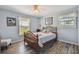 Cozy bedroom with a queen-size bed and wooden dresser at 1914 24Th W Ave, Palmetto, FL 34221