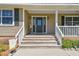 Dark green front door with a sidelight and a welcoming porch at 1914 24Th W Ave, Palmetto, FL 34221