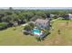 Aerial view of house with pool and fenced backyard at 1914 24Th W Ave, Palmetto, FL 34221