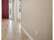 Light and airy entryway with tile flooring and red door at 1048 Bradberry Dr, Nokomis, FL 34275
