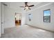 Spacious main bedroom with ensuite bathroom access and two windows at 1048 Bradberry Dr, Nokomis, FL 34275